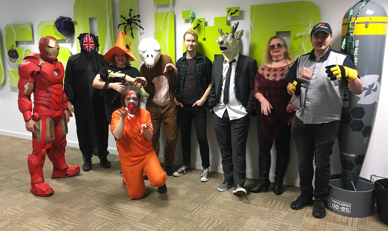 Staff pose in their Halloween costumes.